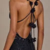 Vestido largo con escote pronunciado y espalda abierta adornado de Etoile en negro