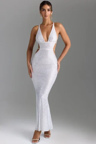 Vestido largo sin espalda con aberturas y adornos Magdalena en blanco