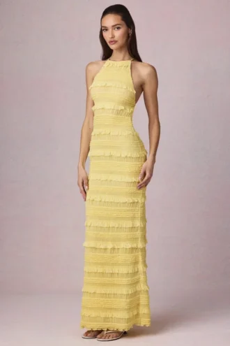 Vestido largo sin espalda con cuello halter y volantes Tove en amarillo limón