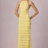 Vestido largo sin espalda con cuello halter y volantes Tove en amarillo limón