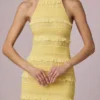 Vestido largo sin espalda con cuello halter y volantes Tove en amarillo limón