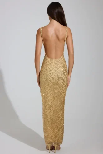 Vestido largo Yarina con cuello redondo y abertura en el muslo, adornado en dorado