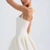 Vestido micro corto con corsé, cuello halter y bajo abullonado con cordones Ludmila en color marfil