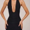 Vestido midi con cuello halter y abertura en el bajo de Storie en negro