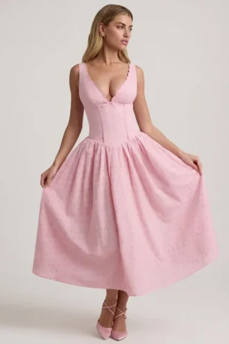 Vestido midi de corte A con detalle de lazo y bordado inglés de Saidey en rosa suave