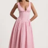 Vestido midi de corte A con detalle de lazo y bordado inglés de Saidey en rosa suave