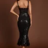 Vestido midi-longo Raffaella con corsé y aberturas, adornado con lentejuelas, en estampado de cebra negro
