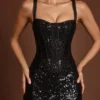 Vestido midi-longo Raffaella con corsé y aberturas, adornado con lentejuelas, en estampado de cebra negro