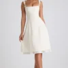 Vestido midi plisado de corte A con lazo Isadora en color marfil