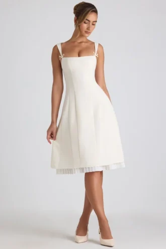 Vestido midi plisado de corte A con lazo Isadora en color marfil