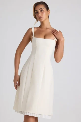 Vestido midi plisado de corte A con lazo Isadora en color marfil