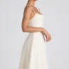Vestido midi plisado de corte A con lazo Isadora en color marfil